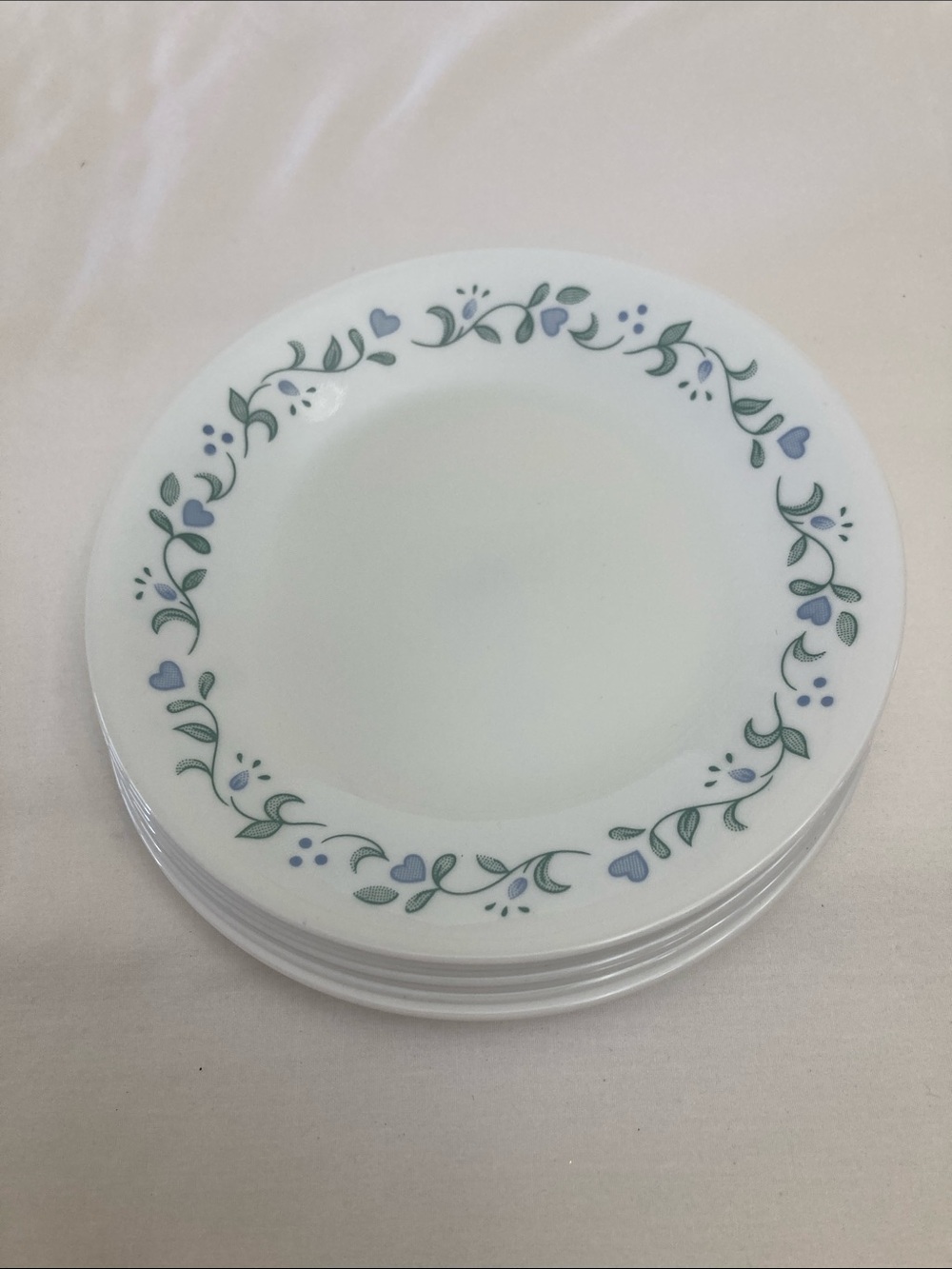 7 Corelle Country Cottage Virtelle Dessert Plates with Blue Hearts and green.